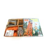 A Palitoy Action Man training tower, with escape slide and crane, boxed.