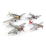 Four built and painted model aircraft, including a Spitfire, and three USAAF planes.