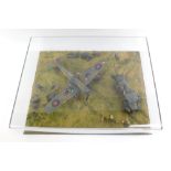 An diorama of a Mk1 Hawker Hurricane, 1:48 scale, Battle of Britain scene with figures, in a perspex