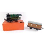 A Hornby Trains O gauge tin-plate clockwork locomotive, 50153 and a LNER teak guards coach. (2)