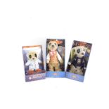 Three Compare The Meerkat figures, to comprising Vassily, Yakov, and Baby Oleg, boxed.