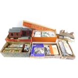 Various railway buildings, cardboard examples, trackside accessories, signal gantry, plastic outbuil