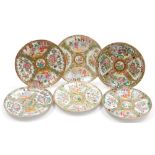Six various 19thC Cantonese porcelain plates, decorated in enamels with panels of figures and flower
