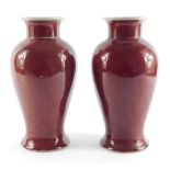 A pair of Chinese sang de boeuf porcelain vases, of baluster form, 25cm high.