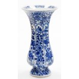 A Chinese blue and white Kangxi beaker vase, decorated with panels of chrysanthemum branches between