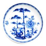 A Chinese blue and white porcelain saucer, painted with 'The Three Friends' within diaper border, pr