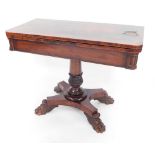 A Regency mahogany fold over card table, with canted corners, opening to reveal a red lined table in