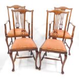 A set of four early 20thC Georgian style oak dining chairs, with drop-in seats, raised on cabriole