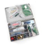 A small fishing tackle box, and an assortment of Devon Minnows, etc, to include lead weights, and