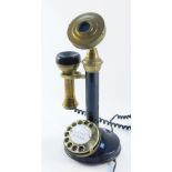 An Astral Telecom candlestick telephone, with speaker and detachable receiver, on black finish with