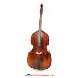 A Boosey & Hawkes Double Strad double bass, 3/4 size, with a bow.