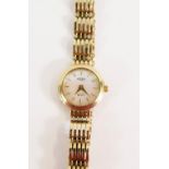 A Rotary 9ct gold lady's wristwatch, with mother of pearl dial, 1.5cm wide, on five row curb link br