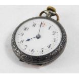 A continental lady's silver pocket watch, open faced, keyless wind, enamel dial bearing Arabic numer