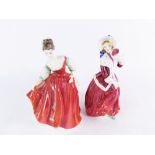 Two Royal Doulton ladies, comprising Christmas Morn HN1992, and Fair Lady (red) HN2832, 19cm high.