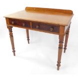 An early 19thC mahogany side table, with a pair of frieze drawers, raised on turned legs, 74cm high,