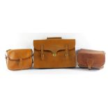 Three leather satchels, to include a leather laptop satchel and two ladies handbags, each in tanned