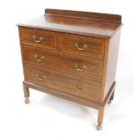 An Edwardian mahogany and boxwood lined inlaid chest, of two short over two long drawers, raised