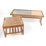 A G-Plan 1960's teak glass and tile inset coffee table, raised on shaped end supports, united by a
