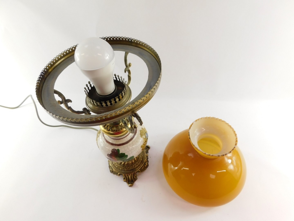 A 20thC oil lamp style electric table lamp, with orange glass shade on a brass three prong support, - Image 4 of 4