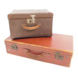 Two vintage travel cases, comprising a brown leather travel trunk, and a brown material trunk, large