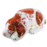 A Royal Crown Derby Puppy paperweight, Collector's Guild 2000, gold stopper, 9cm wide.