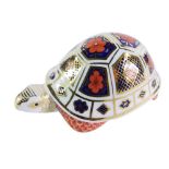 A Royal Crown Derby Imari tortoise paperweight, lacking stopper, No XLIX, 12cm wide, boxed.