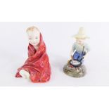 Two Royal Doulton porcelain figures, comprising River Boy HN2128, 10cm high, and This Little Pig HN1