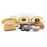 A group of vintage telephones, casing, dials, accessories, all AF. (1 box)