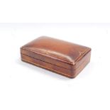 A leather and gilt tooled finish cuff links box, 14cm wide.