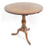 A Georgian early 19thC oak occasional table, with circular top, raised on a baluster turned