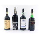 Four bottles of port, comprising W & J Grahams 1986 Vintage, a 21st Special Air Service Regiment Spe