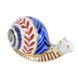 A Royal Crown Derby snail paperweight, silver stopper, 8cm high, boxed.