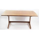 A Vanson 1960's teak draw leaf dining table, with one additional leaf, raised on shaped end