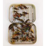 A collection of salmon fishing flies, contained in an antique metal case, lacking most of original