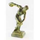 A patinated plaster figure of the Discobolus of Myron, on a stepped base, 41cm high.