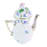 A Herend porcelain coffee pot, of baluster form, with rose finial and painted blue flower detailing,