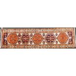 A Turkish Kilim grey ground runner, with five central medallions, having geometric motifs, within re