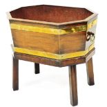 A 19thC mahogany and brass bound octagonal wine cooler, with plain interior, on canted legs, 50cm hi