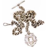 A heavy curb link silver watch chain, with two clip clasps and T bar, together with a shield fob, th