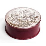 An Elizabeth II silver and leather circular dressing table box, the silver inset lid embossed with c