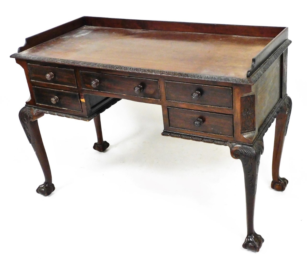 An early 20thC Chippendale style mahogany dressing table, with three part galleried back, with a hea