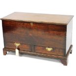 An 18thC oak mule chest, the hinged lid enclosing a vacant interior above two drawers, on bracket fe