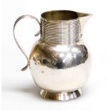 A George II silver jug, with a globular shaped body, fluted neck and sparrow beak, possibly Thomas M