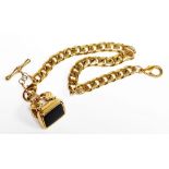 A gold plated seal and watch chain, the curb link chain with T bar and additional clip, set with bla