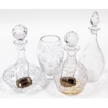 A group of cut glass , comprising a decanter with plated port label, 25cm high, a bottle shaped deca