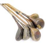 Five 20thC hickory shafted golf clubs, together with an iron shafted club. (6)