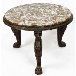 A late 19thC Continental marble topped occasional table, the circular top raised on heavily carved l