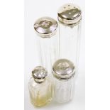 Four silver topped dressing table jars, hat pin jar, a scent bottle of shouldered form with silver l