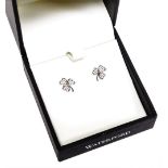 A pair of silver and stone set three leaf clover earrings, each with butterfly backs, in a fitted ca