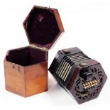 A late 19thC mahogany and canvas concertina or squeeze box, with twenty four painted bone keys, 15cm